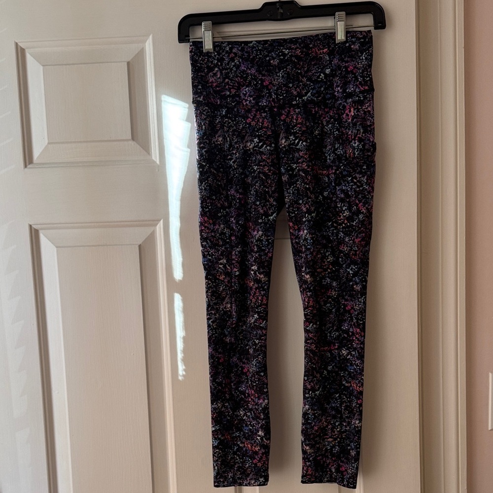 Lululemon Athletica Multicolor Floral Leggings. Black background